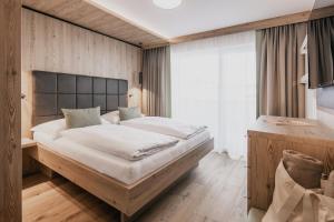 Voodi või voodid majutusasutuse FIRSTpeak Chalets toas