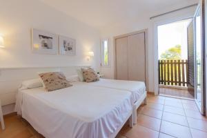 Postel nebo postele na pokoji v ubytování Apartamento Ferrera Park 406 + 19 fotografií