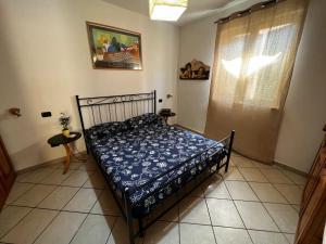 Un pat sau paturi într-o cameră la Casa al mare vicino Roma