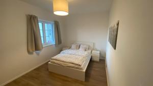 Postel nebo postele na pokoji v ubytování Ferienwohnung mit Garten