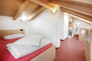A bed or beds in a room at Baita Truzz appartamento Valle