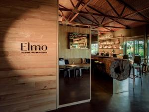 a restaurant with a bar with a sign on the wall at Lavandeira Douro Nature & Wellness in Baião