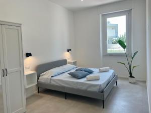 Ένα ή περισσότερα κρεβάτια σε δωμάτιο στο Poetto Beach House-Ausonia