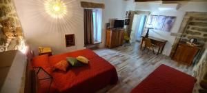 a living room with a red bed and a living room with at Kabula in Olbia