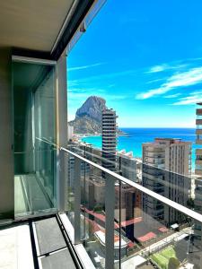 a balcony with a view of the ocean and mountains at Mirador de Calpe. Apartment with panoramic views. in Calpe