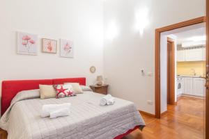 Кровать или кровати в номере Piombino Apartments - Casa Garibaldi