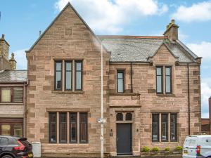 a large brick house with a roof at Apartment 1 - Ukc6766 in Arbroath