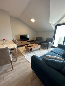a living room with a couch and a table at İMA APART in Trabzon