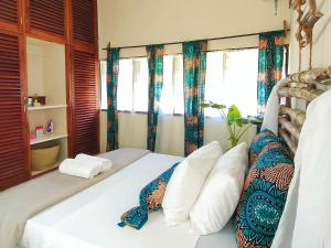 Katil atau katil-katil dalam bilik di Palm Paradise Loft