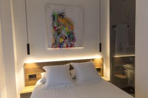 Postel nebo postele na pokoji v ubytování RÍOS SUITES Tudela