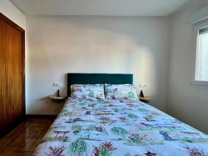 Postel nebo postele na pokoji v ubytování Ático con vistas en el centro