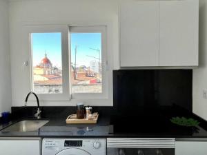 Kuchyň nebo kuchyňský kout v ubytování Ático con vistas en el centro