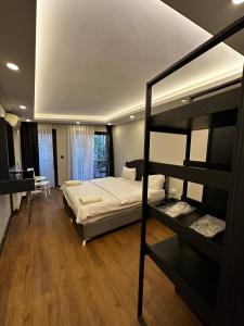a bedroom with a bunk bed and a desk at Galata King Suite Hotel in Istanbul