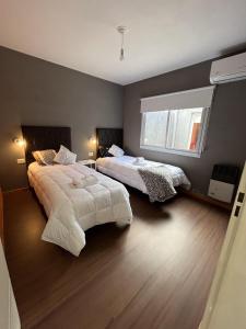 Postel nebo postele na pokoji v ubytování El Marqués Apart