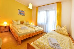 Postel nebo postele na pokoji v ubytování Apartments Jasmina