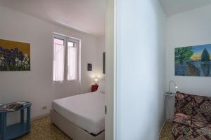 A bed or beds in a room at Casa Artè by Wonderful Italy