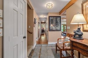 a hallway with a door leading into a house at Marina Beach Lodge - Lakefront Home on Beach! home in Groveland