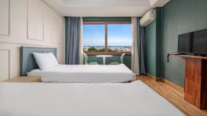Postel nebo postele na pokoji v ubytování Hiker Hotel