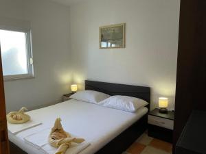 Posteľ alebo postele v izbe v ubytovaní Apartments Molo Mare