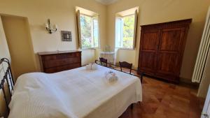 Postel nebo postele na pokoji v ubytování VILLA AUGUSTA