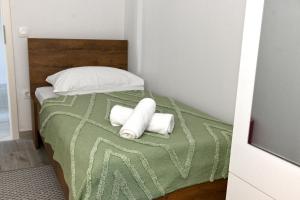 Postel nebo postele na pokoji v ubytování Golden Neretva apartments