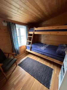 Postel nebo postele na pokoji v ubytování Naustplassen Rorbuer