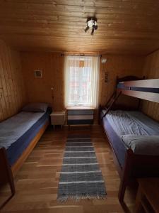 Postel nebo postele na pokoji v ubytování Naustplassen Rorbuer
