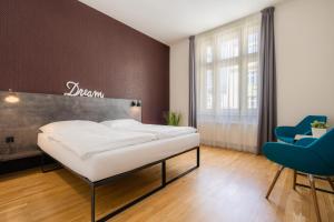 Posteľ alebo postele v izbe v ubytovaní EA ApartHotel Melantrich