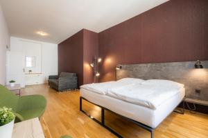 Posteľ alebo postele v izbe v ubytovaní EA ApartHotel Melantrich