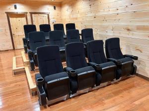 a row of chairs in a room with a wooden wall at * * 4 Master Bedrooms, Views, Theater, Arcade, EVC in Gatlinburg