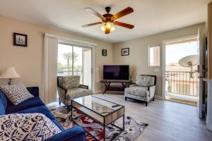 a living room with a couch and a ceiling fan at Las Vegas Condo with Private Balcony 10 Mi to Strip in Las Vegas