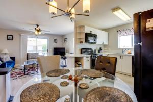 a kitchen and living room with a table and chairs at Las Vegas Condo with Private Balcony 10 Mi to Strip in Las Vegas
