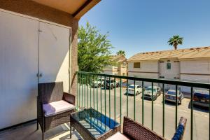 a balcony with chairs and a view of a parking lot at Las Vegas Condo with Private Balcony 10 Mi to Strip in Las Vegas