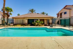 a swimming pool in front of a house at Las Vegas Condo with Private Balcony 10 Mi to Strip in Las Vegas