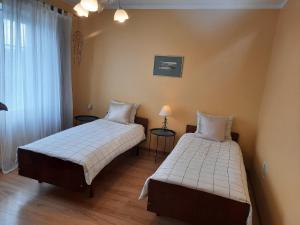 Postel nebo postele na pokoji v ubytování Šeimos Būstas Homestay