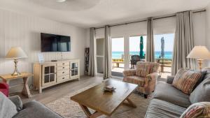 a living room with a view of the ocean at Blue Nine 3 in Panama City Beach