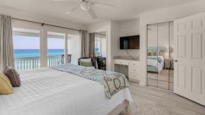a bedroom with a bed with a view of the ocean at Blue Nine 3 in Panama City Beach +87 photos