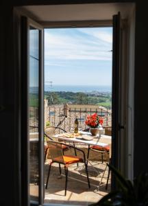 a view of a balcony with a table and chairs at Appartamento Natinguerra in Civitanova Marche