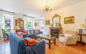 a living room with blue couches and a fireplace at Villa Poss in Villa