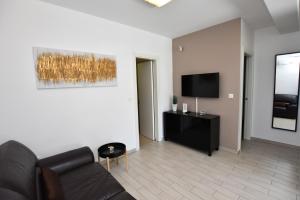 TV a/nebo společenská místnost v ubytování Apartments Nika