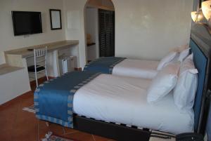 Un pat sau paturi într-o cameră la Hotel Al Khaima