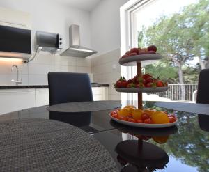Kuchyň nebo kuchyňský kout v ubytování Apartments Nika