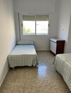 Tempat tidur dalam kamar di Apartamento Kelibia