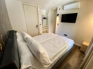 Postel nebo postele na pokoji v ubytování Boutique hotel ZBILJE