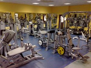 a gym filled with lots of exercise equipment at Aktea Beach Village in Ayia Napa