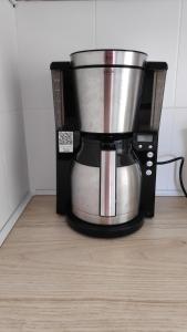 a coffee pot is sitting in a coffeemaker at Klara w Ogrodzie in Łeba
