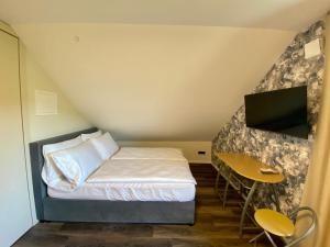 Postel nebo postele na pokoji v ubytování Boutique hotel ZBILJE