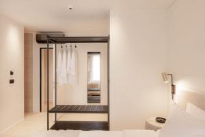 Una cama o camas en una habitación de Doryssa Theorem Hotel