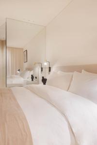 Una cama o camas en una habitación de Doryssa Theorem Hotel