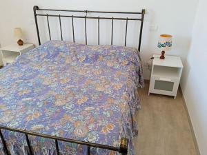 En eller flere senge i et værelse på Casa vacanze in pietra Il Nibbio Reale